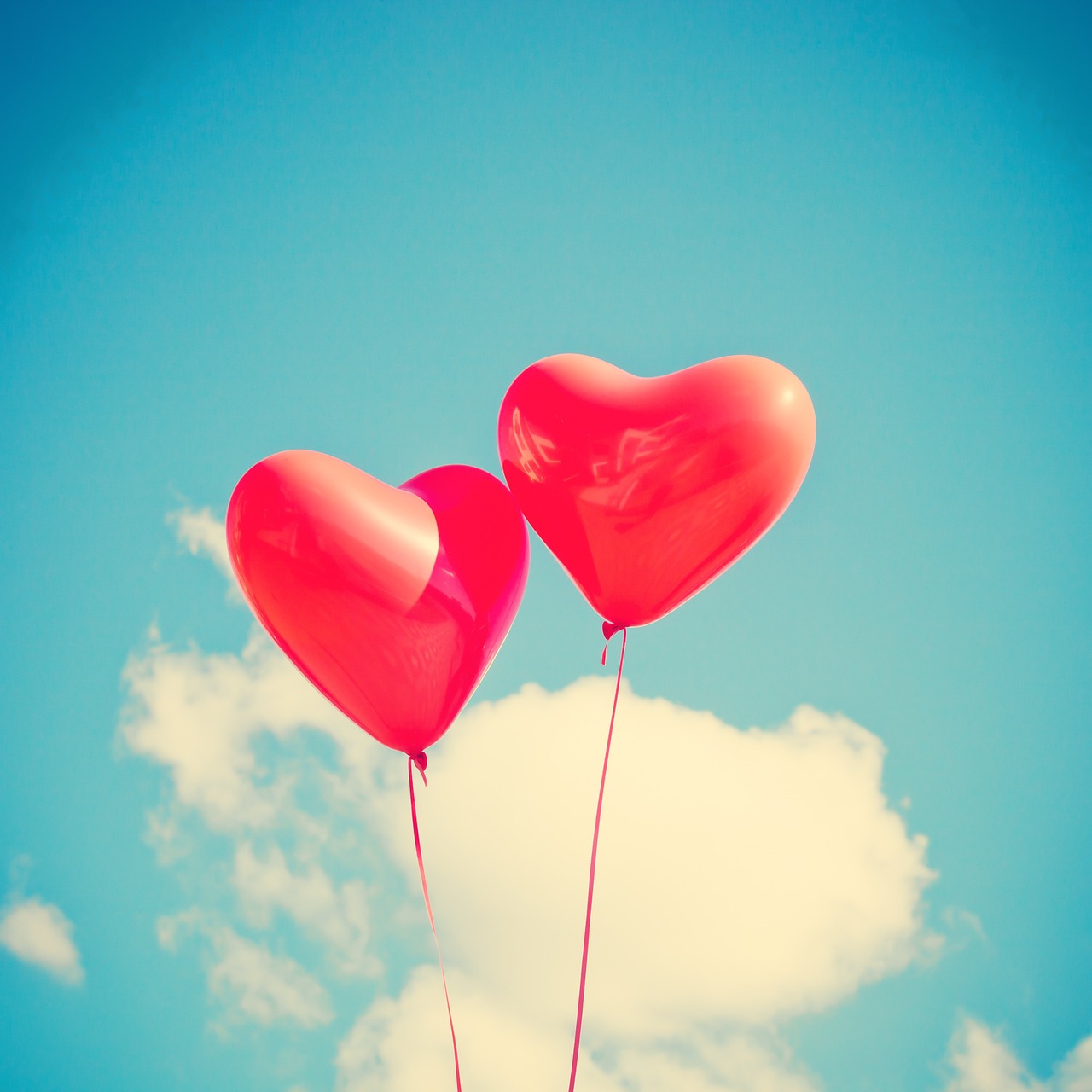 Heart balloons in front of clouds avatar